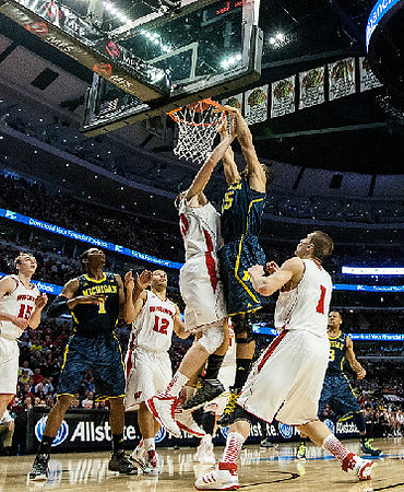 Glenn Robinson III (1), Jon Horford (15), and Trey Burke (3)