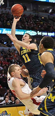 Nik Stauskas (11) and Jordan Morgan (52)