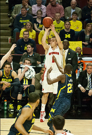 Jon Horford (15) and Caris LeVert (23)
