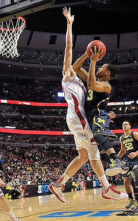 Trey Burke (3) and Jordan Morgan (52)