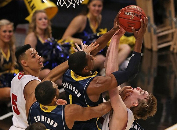 Jon Horford (15) and Glenn Robinson III (1)