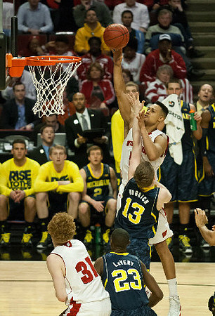 Caris LeVert (23) and Matt Vogrich (13)
