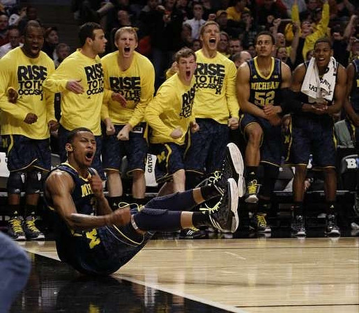 Trey Burke (3) and Michigan Team