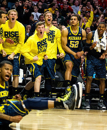 Trey Burke (3) and Michigan Team