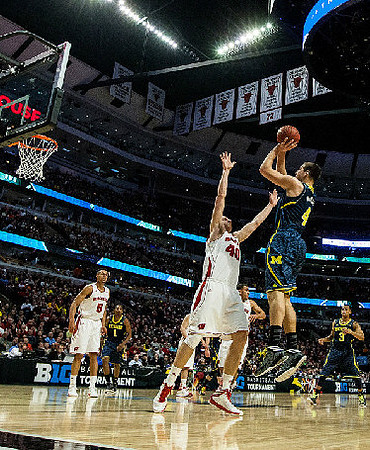 Glenn Robinson III (1), Mitch McGary (4), and Trey Burke (3)