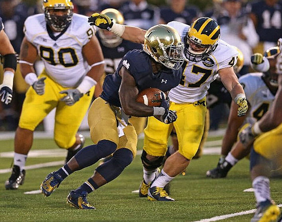 Bryan Mone (90) and Jake Ryan (47)