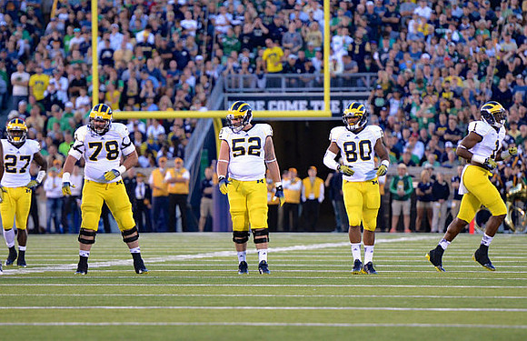 Derrick Green (27), Erik Magnuson (78), Mason Cole (52), Khalid Hill (80), and Devin Funchess (1)
