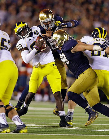 Mason Cole (52), Devin Gardner (98), and Graham Glasgow (61)