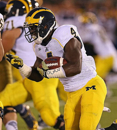 Ben Braden (71) and De'Veon Smith (4)