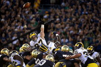 Jourdan Lewis (26), Brennen Beyer (97), Willie Henry (69), Joe Bolden (35), and Jarrod Wilson (22)