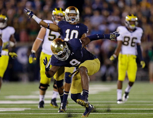 Mason Cole (52) and Jehu Chesson (86)