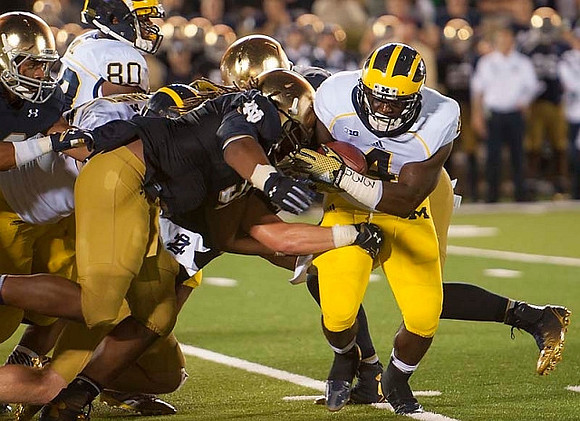 Khalid Hill (80) and De'Veon Smith (4)