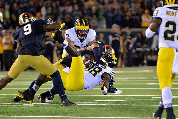 Jack Miller (60), Devin Gardner (98), and Dennis Norfleet (23)