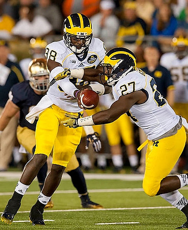 Devin Gardner (98) and Derrick Green (27)