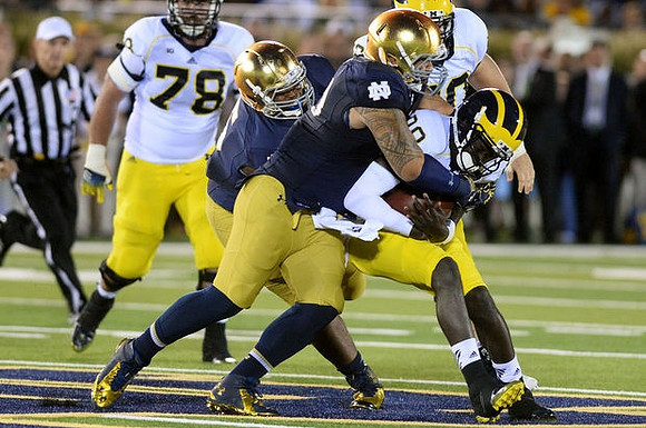 Erik Magnuson (78) and Devin Gardner (98)