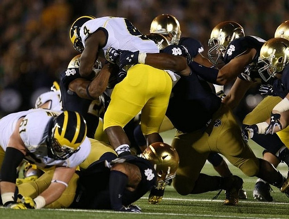 Graham Glasgow (61) and De'Veon Smith (4)
