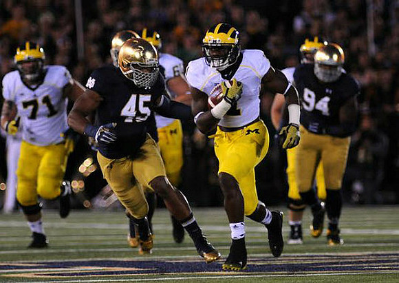 Ben Braden (71) and De'Veon Smith (4)