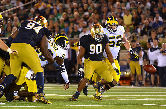 Devin Gardner (98) and Mason Cole (52)