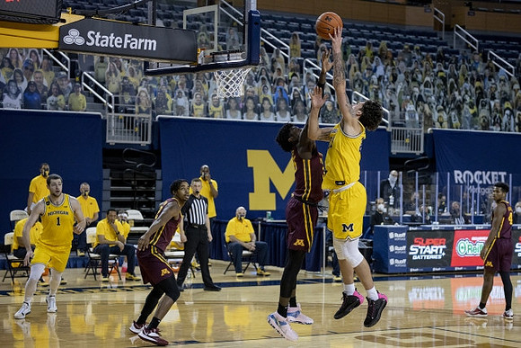 Hunter Dickinson (1) and Brandon Johns Jr. (23)