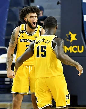 Isaiah Livers (2) and Chaundee Brown Jr. (15)