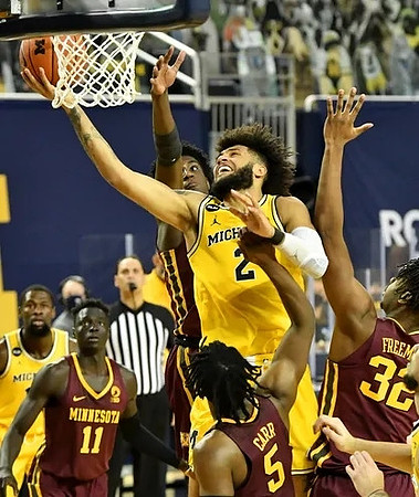 Isaiah Livers (2) and Chaundee Brown Jr. (15)