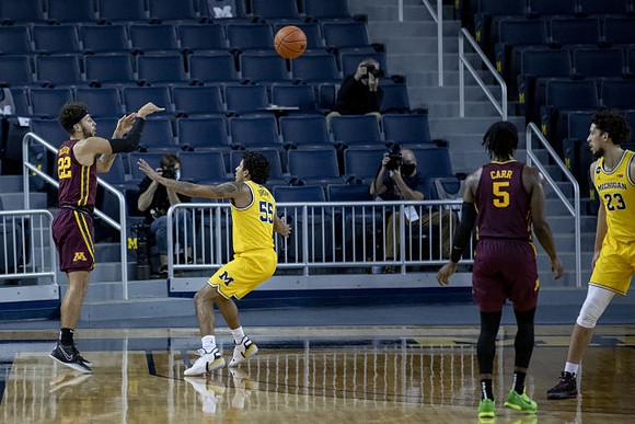 Eli Brooks (55) and Brandon Johns Jr. (23)