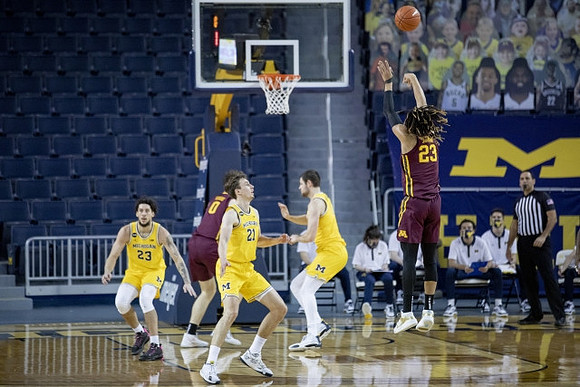 Brandon Johns Jr. (23), Franz Wagner (21), and Hunter Dickinson (1)
