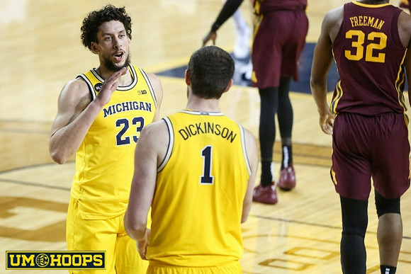 Brandon Johns Jr. (23) and Hunter Dickinson (1)