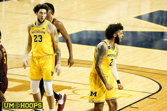 Brandon Johns Jr. (23) and Isaiah Livers (2)