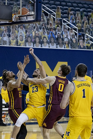 Brandon Johns Jr. (23) and Hunter Dickinson (1)
