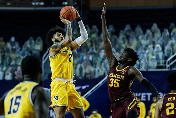 Chaundee Brown Jr. (15) and Isaiah Livers (2)