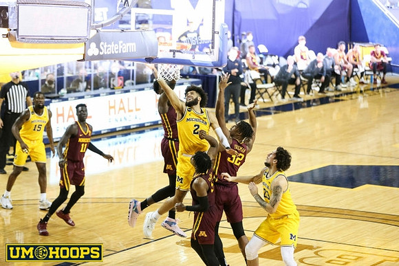 Chaundee Brown Jr. (15), Isaiah Livers (2), and Brandon Johns Jr. (23)