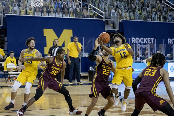 Brandon Johns Jr. (23) and Mike Smith (12)