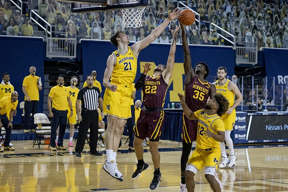 Franz Wagner (21), Mike Smith (12), and Hunter Dickinson (1)