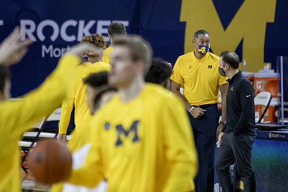 Juwan Howard and Minnesota Head Coach Richard Pitino