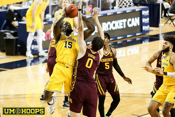 Chaundee Brown Jr. (15), Isaiah Livers (2), and Franz Wagner (21)