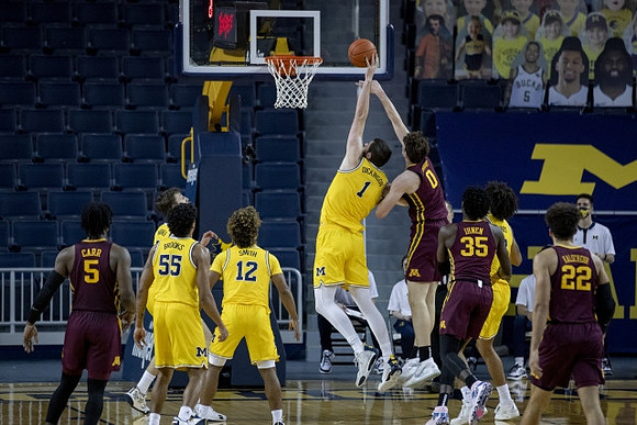 Franz Wagner (21), Eli Brooks (55), Mike Smith (12), Hunter Dickinson (1), and Isaiah Livers (2)