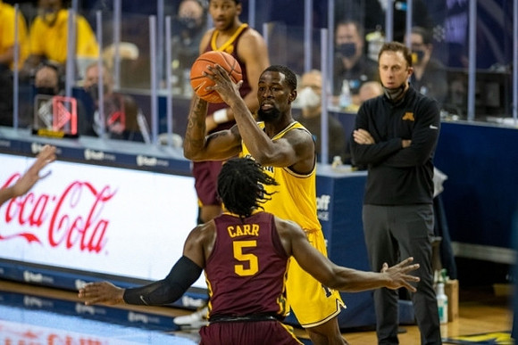 Chaundee Brown Jr. (15) and Minnesota Head Coach Richard Pitino
