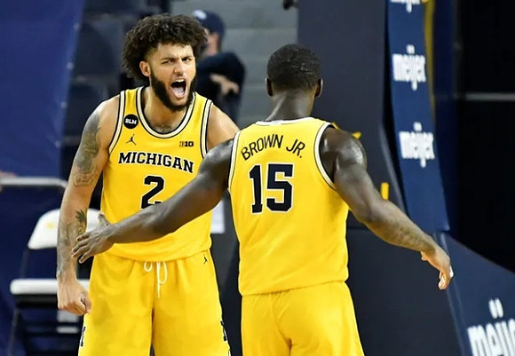 Isaiah Livers (2) and Chaundee Brown Jr. (15)