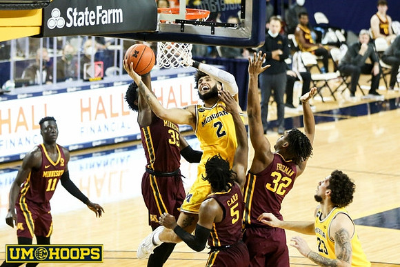 Isaiah Livers (2) and Brandon Johns Jr. (23)