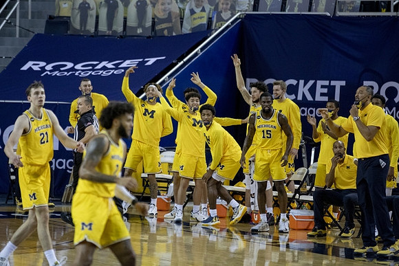 Franz Wagner (21), Isaiah Livers (2), and Michigan Team