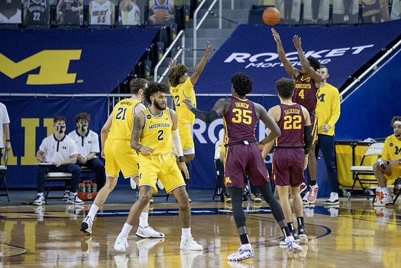 Franz Wagner (21), Isaiah Livers (2), and Mike Smith (12)