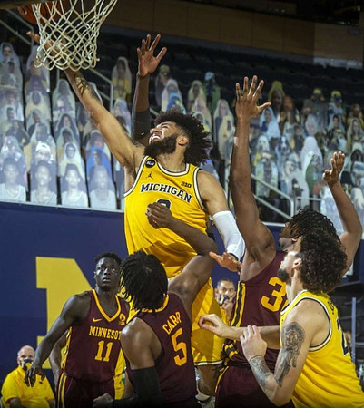Isaiah Livers (2) and Brandon Johns Jr. (23)
