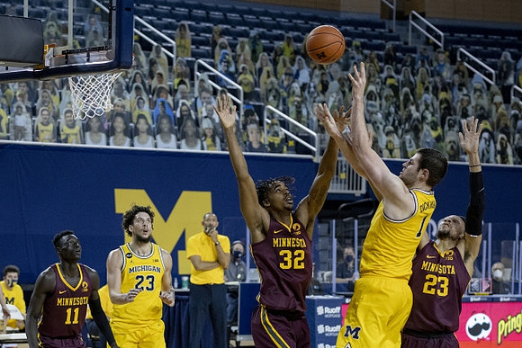 Brandon Johns Jr. (23) and Hunter Dickinson (1)
