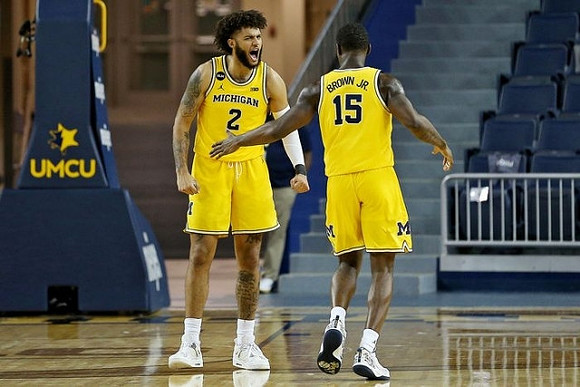 Isaiah Livers (2) and Chaundee Brown Jr. (15)