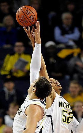 Jordan Morgan (52) and Mitch McGary (4)