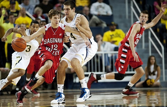 Trey Burke (3) and Mitch McGary (4)
