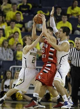 Spike Albrecht (2) and Mitch McGary (4)