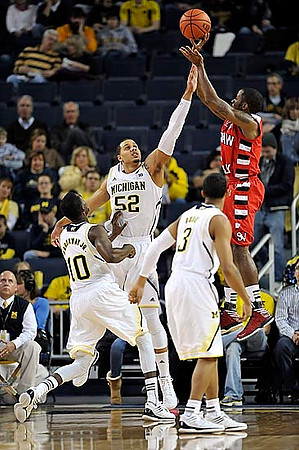 Tim Hardaway Jr. (10), Jordan Morgan (52), and Trey Burke (3)