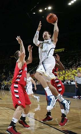 Mitch McGary (4) and Spike Albrecht (2)